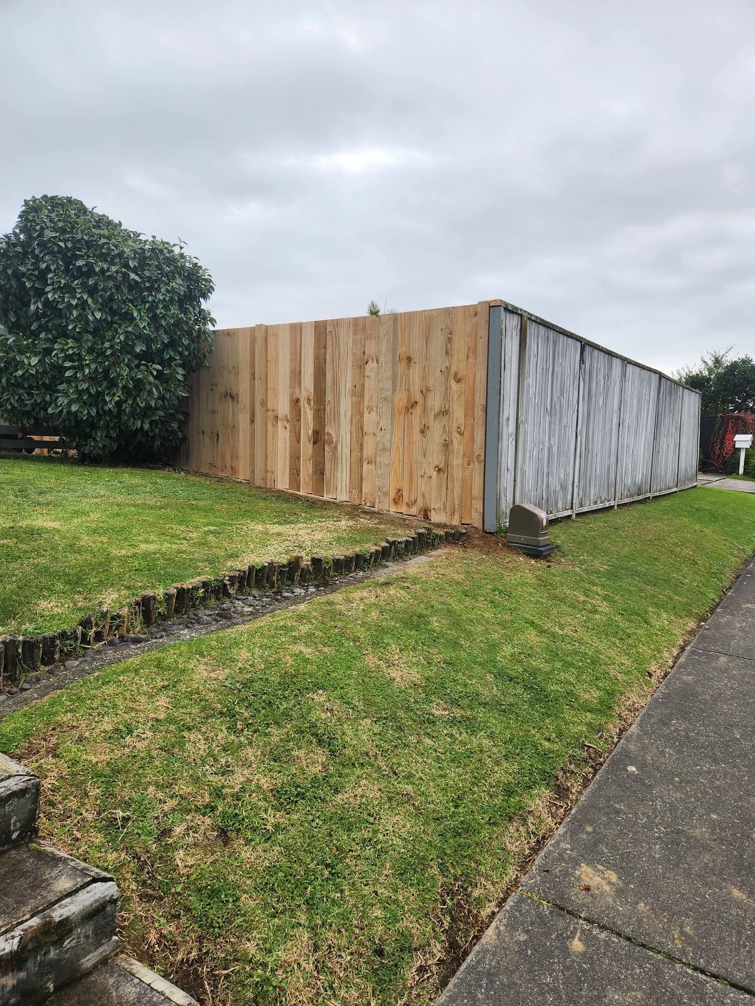 Timber boundary fence construction with horizontal rails