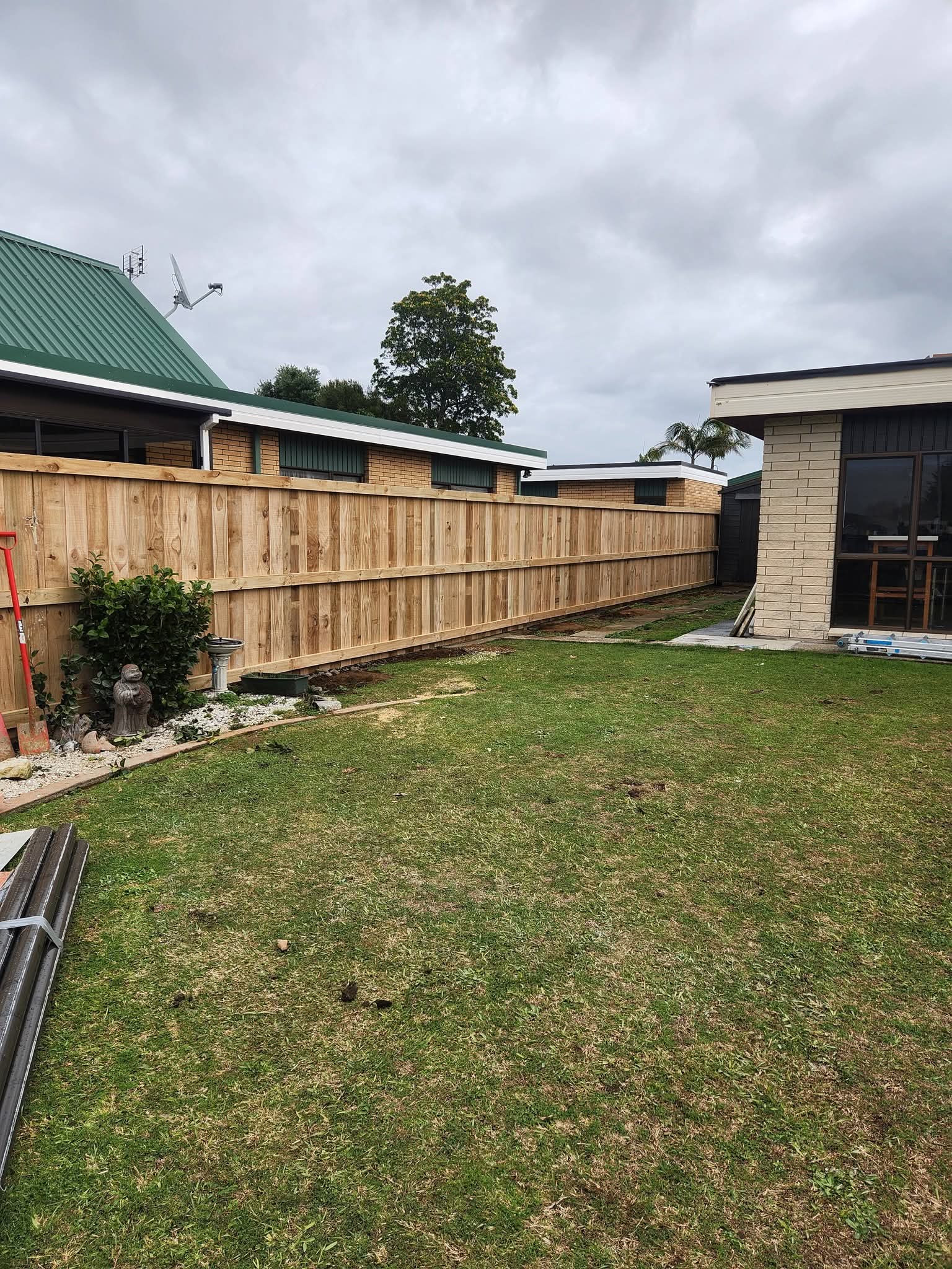 Timber paling front yard fence street view