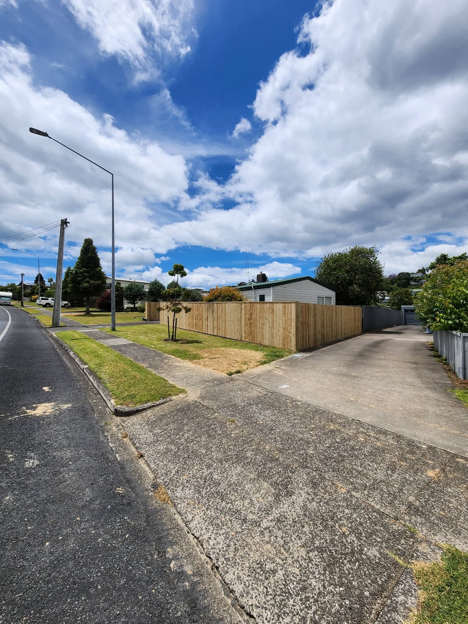Custom steel double driveway gate with timber posts